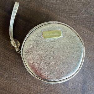 MAC‎ Cosmetics shimmering gold round wrist pouch